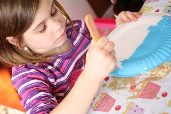 Painting a paper plate blue