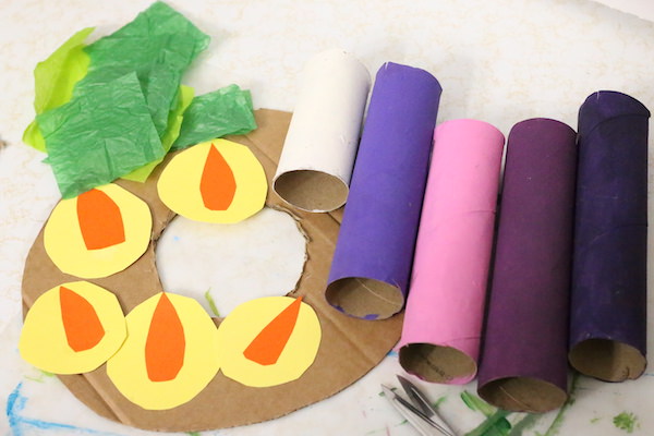 tissue paper, paper flames, cardboard wreath, painted cardboard rolls