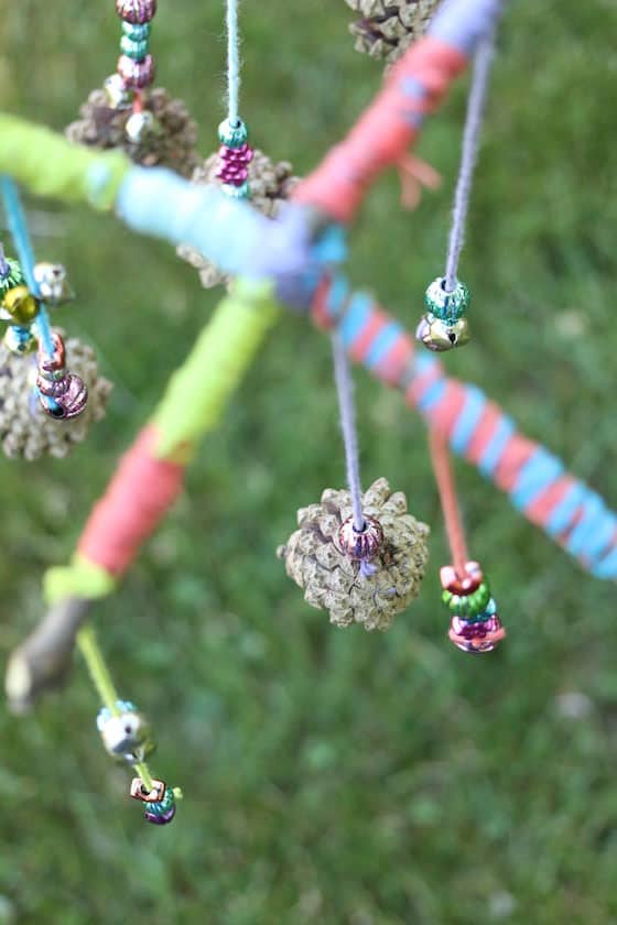 topdown view of stick and pinecone mobile