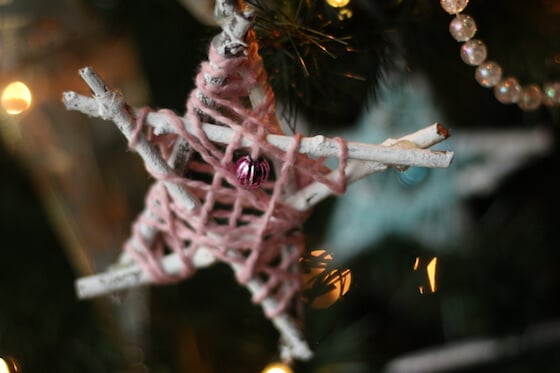 pink yarn wrapped twig star on tree