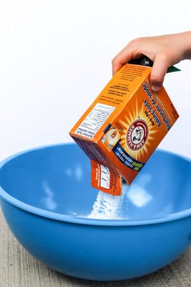 pouring baking soda into bowl