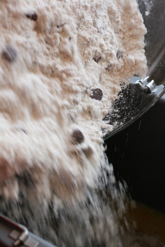 pouring dry ingredients into bread machine