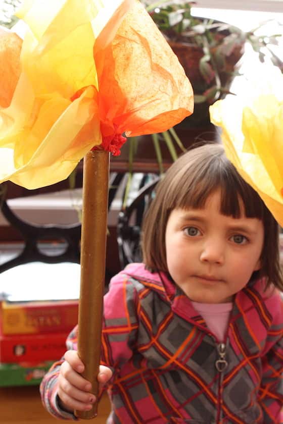 Preschooler holding homemade Olympic torch