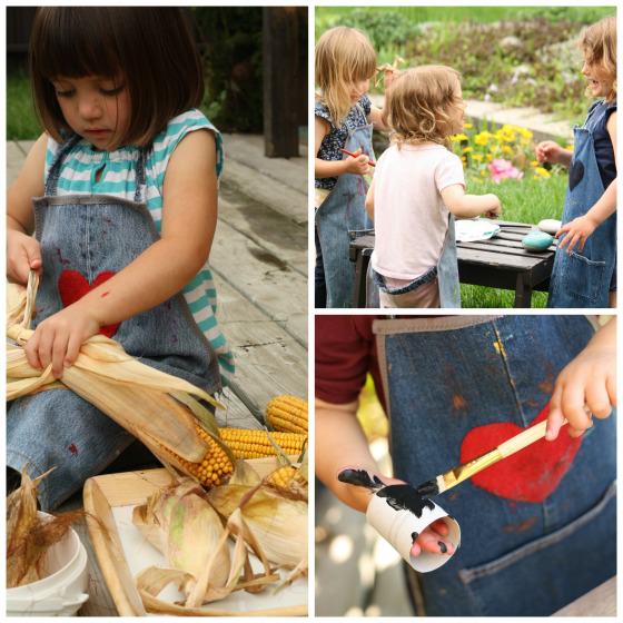 Denim kids' aprons on preschoolers crafting