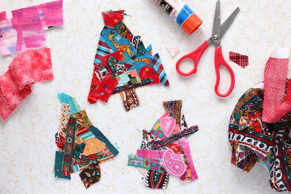 fabric scraps glued to cardboard christmas trees