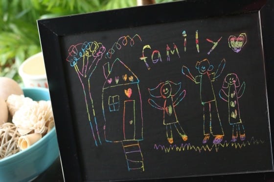 scratch art family portrait by child