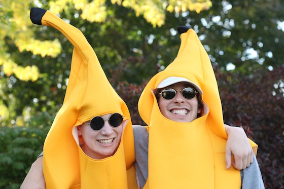 brothers in banana suit costumes getting along, arm in arm