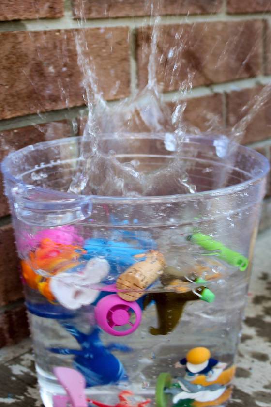 splash from kids dropping toys in water