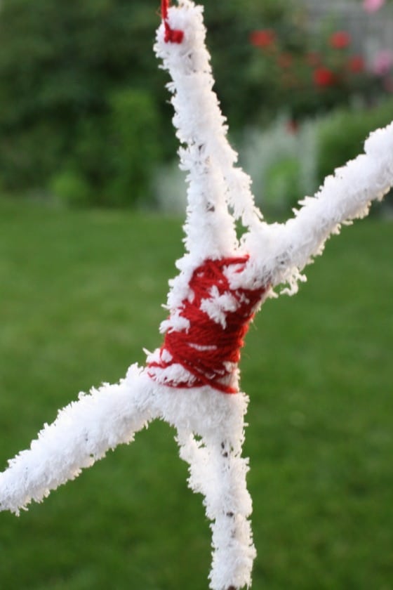 sticks wrapped in yarn