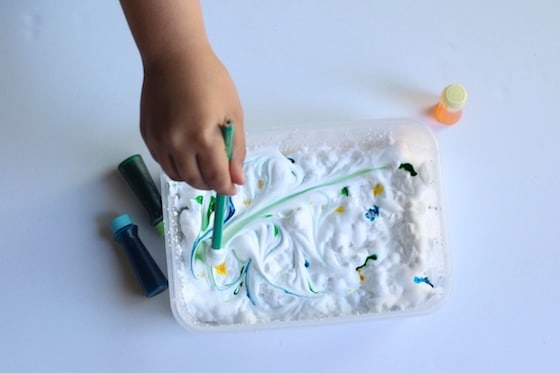 stirring food colour into shaving cream