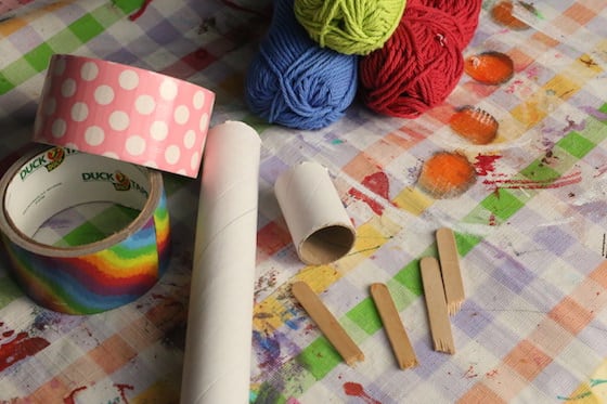 cardboard rolls, yarn, popsicle sticks