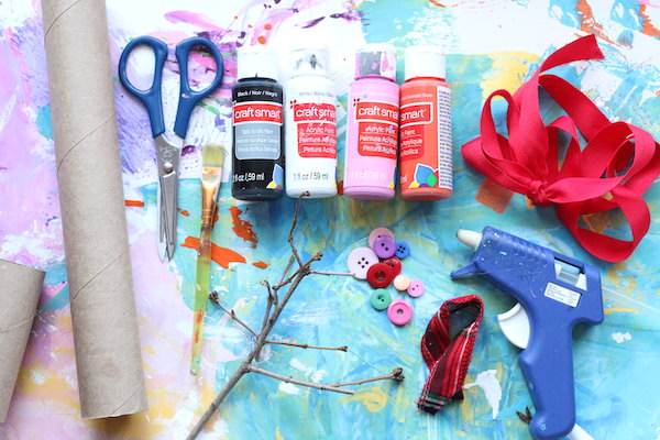 toilet paper rolls, scissors paints, ribbon, buttons, glue gun, twigs