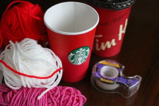 Take-out coffee cups, yarn, tape