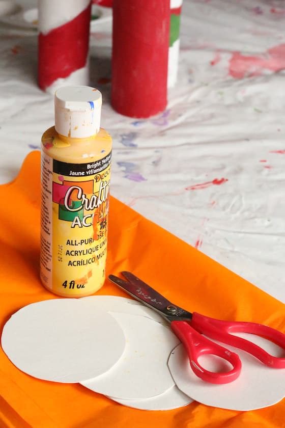 Yellow paint, orange tissue paper, kids scissors
