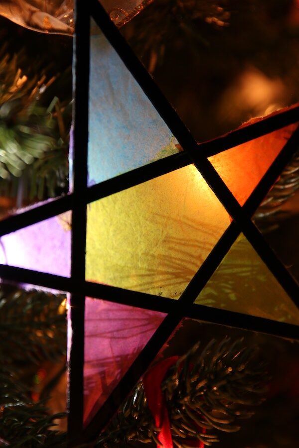 tissue paper stained glass star on christmas tree