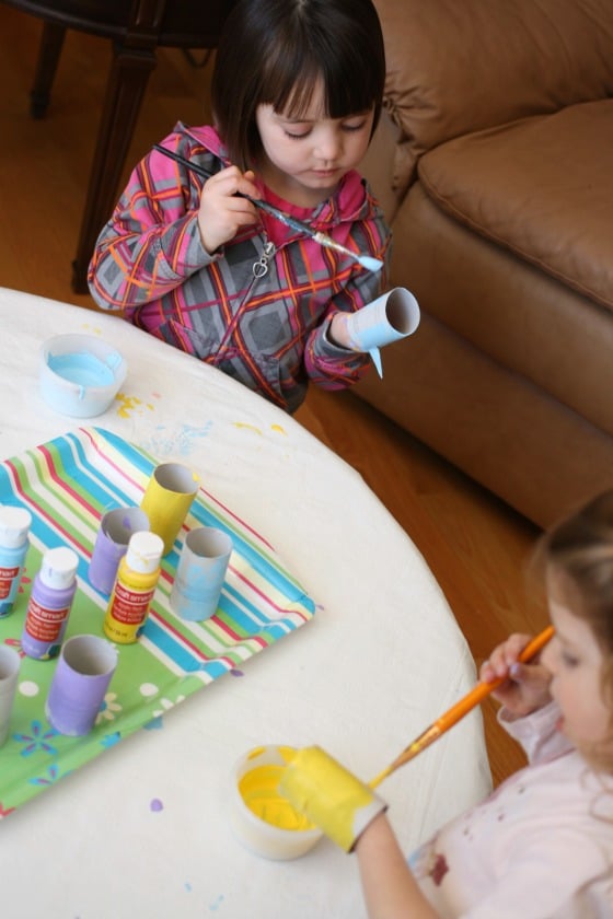 toddler and preschooler painting toilet roll chicks