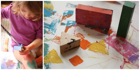 toddler painting with blocks