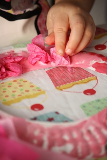 Toddler Sticking Tissue Paper to Paper Plate