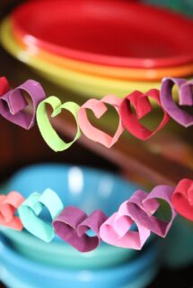 toilet paper roll heart bunting in front of colourful fiesta ware