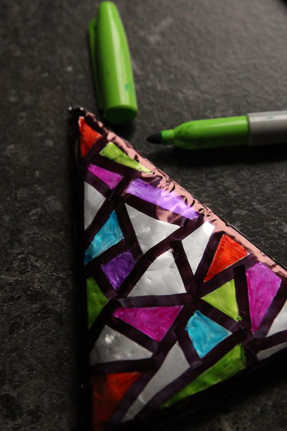 Colouring foil covered cardboard with green sharpie