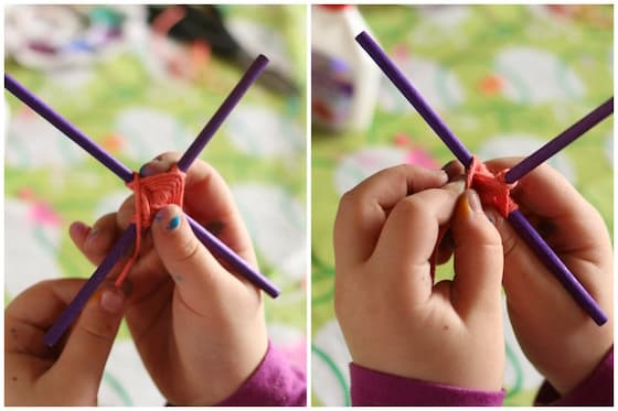 Tween craft 9 year old making God's Eye with craft sticks and orange yarn