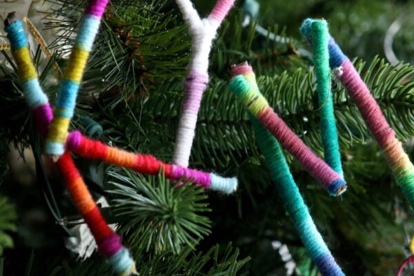 Letters K,Y,M wrapped in yarn on Christmas tree