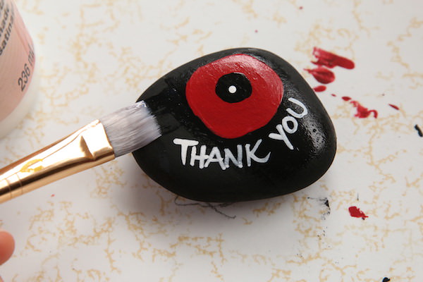 Varnishing poppy stone