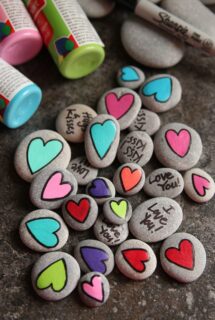 Homemade Painted Heart Worry Stones for Kids with hearts and messages - feature image