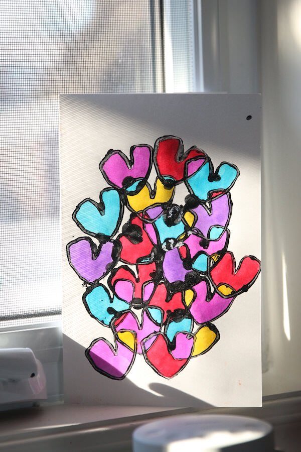 colourful vertical tp heart card on sunny windowsill