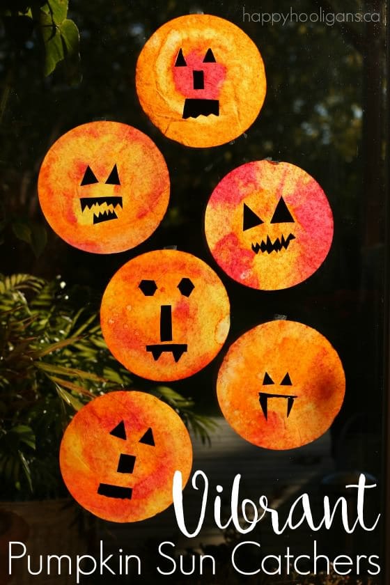 Vibrant Pumpkin Sun Catchers for Kids to Make - Happy Hooligans