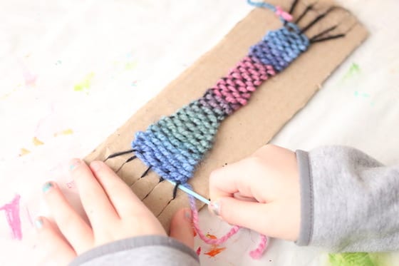 weaving on a cardboard loom